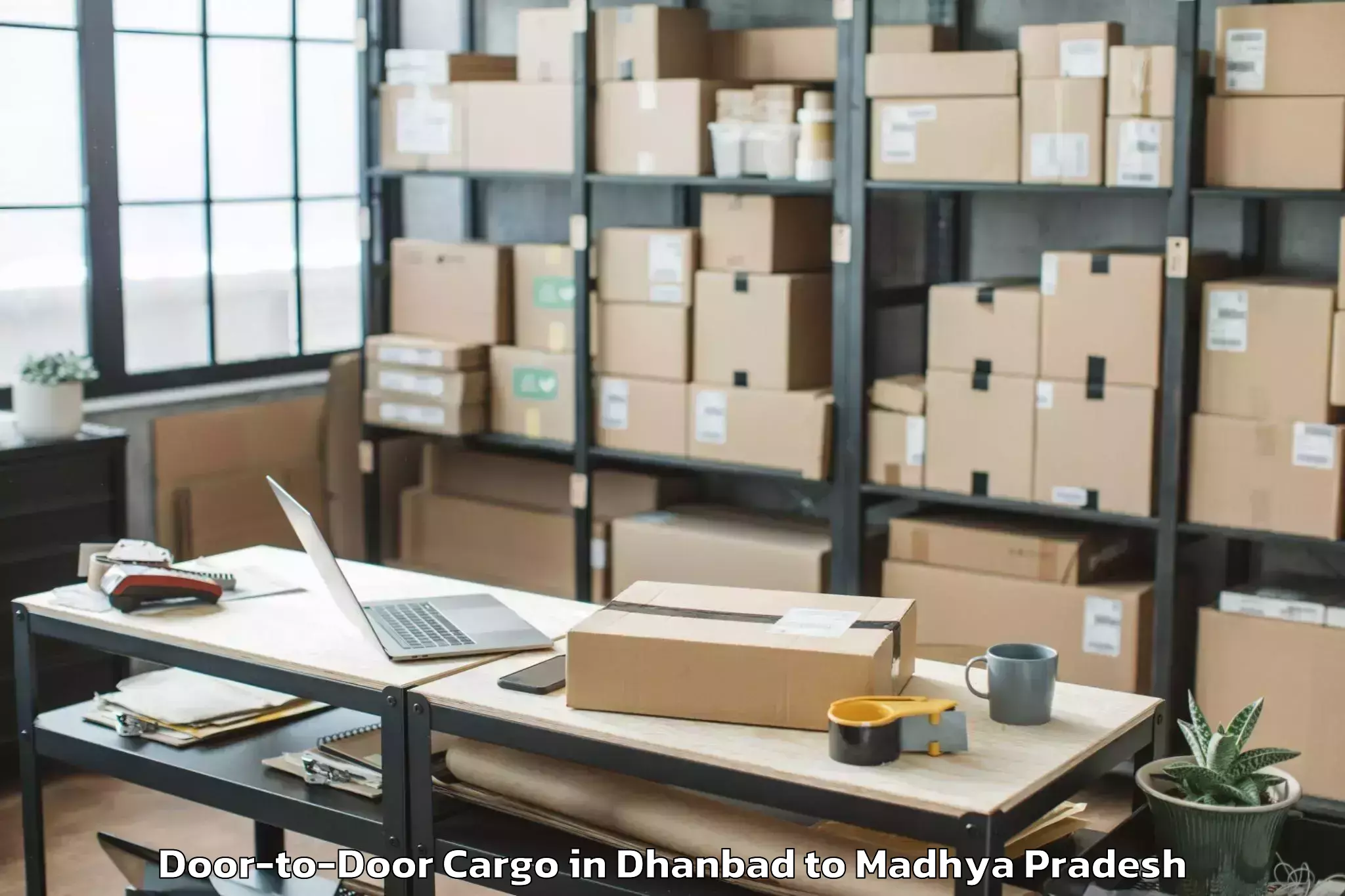 Dhanbad to Mahidpur Door To Door Cargo Booking